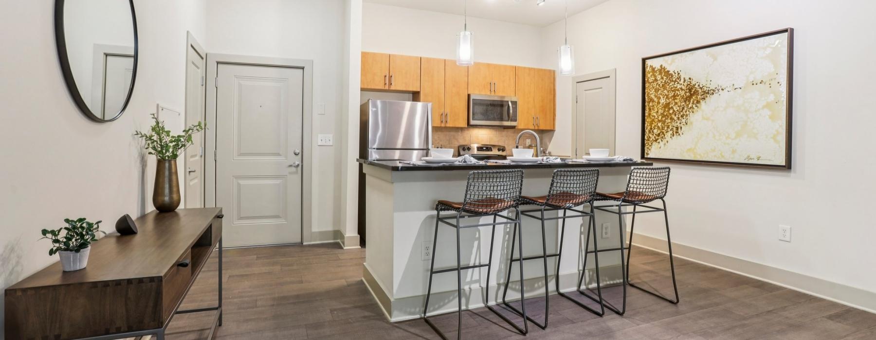 a kitchen with a table and chairs
